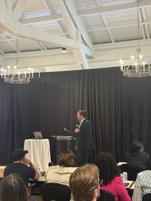 A speaker presenting to the audience