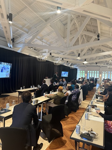 Attendees in the conference room at Four Seasons Resort Nevis