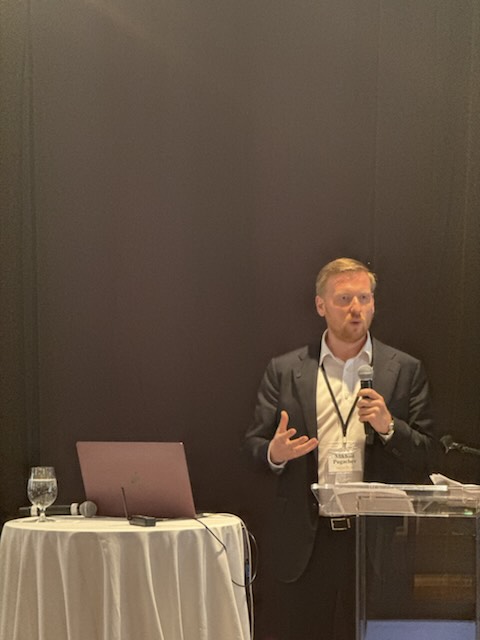 A speaker presenting to the audience
