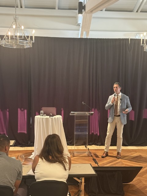 A speaker presenting to the audience